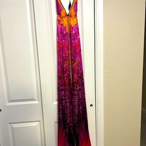 Flowy silk designer sun dress.  Fits beautifully.  Has crystal and rope accents